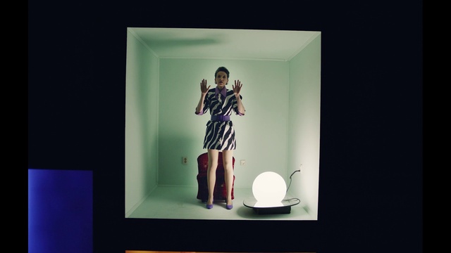 Video Reference: Sleeve, Gesture, Art, Wall, Fashion design, Electric blue, Rectangle, Event, Room, Formal wear