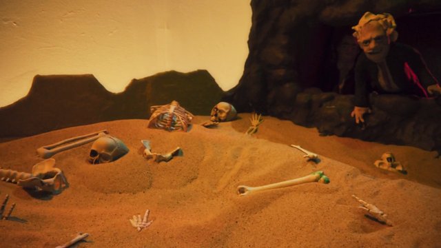 Video Reference: skeleton, skull, bones, sand, desert, cave, creature, horror, dark, macabre, artificial, miniature, scene, surreal