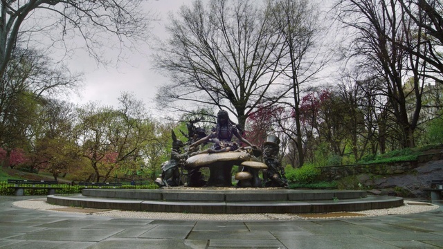 Video Reference: Plant, Sky, Tree, Cloud, Fountain, Building, Sculpture, Road surface, Landscape, Road