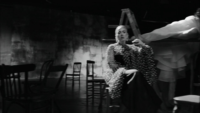 Video Reference: Flash photography, Gesture, Black-and-white, Style, Performing arts, Entertainment, Chair, Fashion design, Music, Monochrome photography