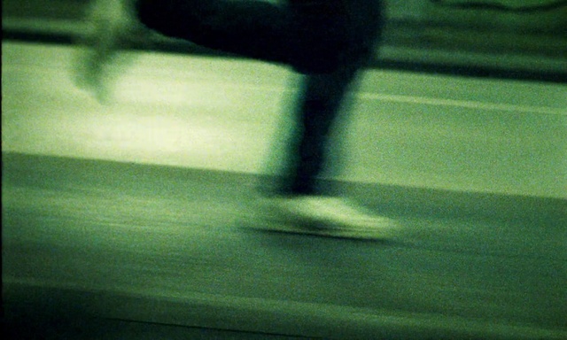 Video Reference: Automotive lighting, Asphalt, Road surface, Tints and shades, Human leg, Knee, Foot, Electric blue, Flooring, Vehicle door