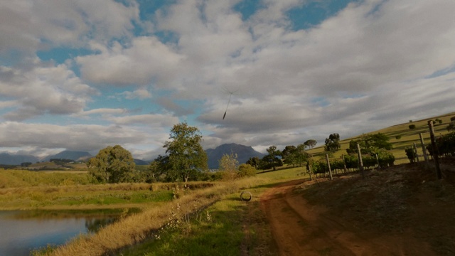 Video Reference: Cloud, Plant, Sky, Mountain, Natural landscape, Land lot, Vegetation, Tree, Bank, Landscape