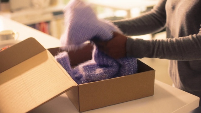 Video Reference: Shipping box, Packing materials, Gesture, Wrist, Nail, Thigh, Blazer, Wood, Knee, Carton