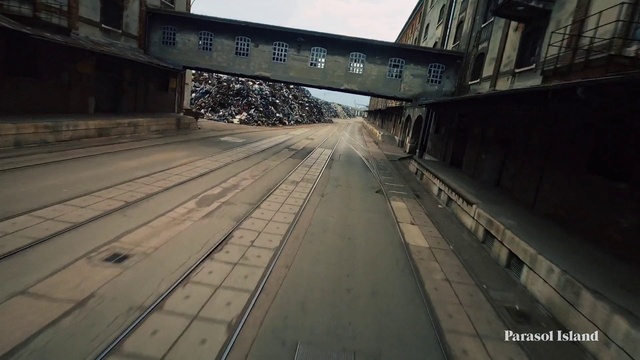 Video Reference: Road surface, Asphalt, Mode of transport, Wood, Thoroughfare, Sky, Road, Tints and shades, City, Metal