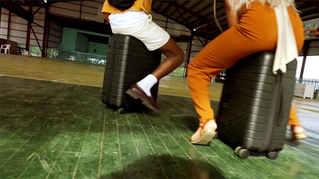 Video Reference: Joint, Flooring, Thigh, Knee, Floor, Waist, Automotive tire, Luggage and bags, Bag, Fun