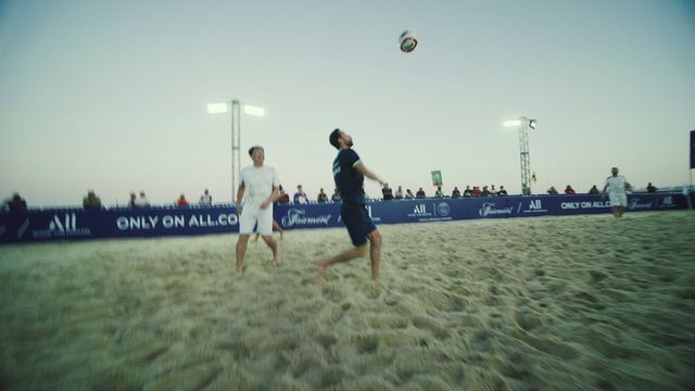 Video Reference: Sky, Sports equipment, Football, Net sports, People on beach, Ball, Body of water, Beach, Volleyball, Sports