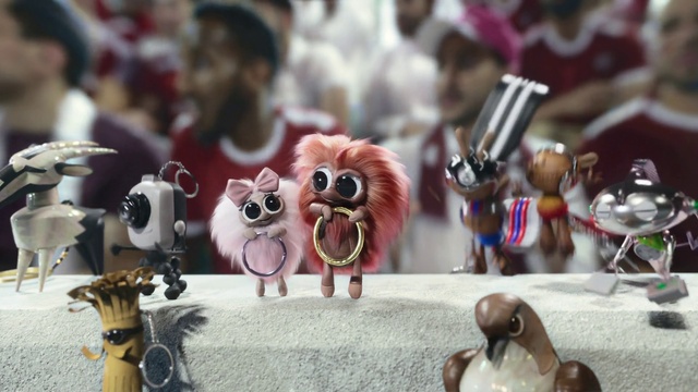 Video Reference: Toy, Souvenir, Hat, Fawn, Red, Event, Fictional character, Action figure, Fashion accessory, Carmine