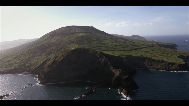 Video Reference: Water, Sky, Mountain, Cloud, Highland, Coastal and oceanic landforms, Terrain, Landscape, Lake, Mountainous landforms