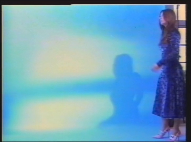 Video Reference: Gesture, One-piece garment, People in nature, Performing arts, Electric blue, Art, Display device, Event, Entertainment, Fashion design