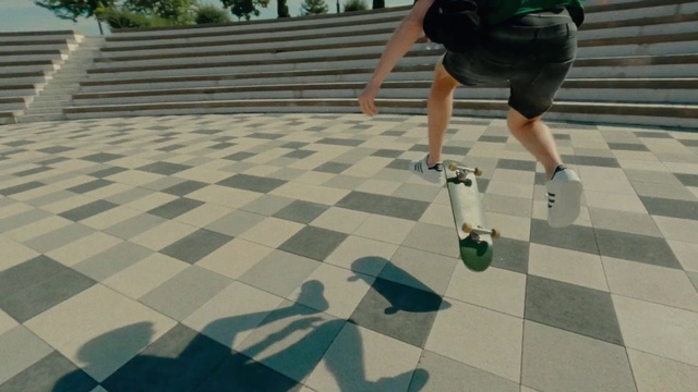 Video Reference: Shorts, Green, Black, Flooring, Floor, Road surface, Leisure, Recreation, Grass, Asphalt