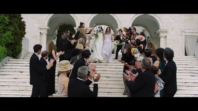 Video Reference: Wedding dress, Bride, Coat, Dress, Bridal clothing, Flash photography, Gesture, Happy, Gown, Suit