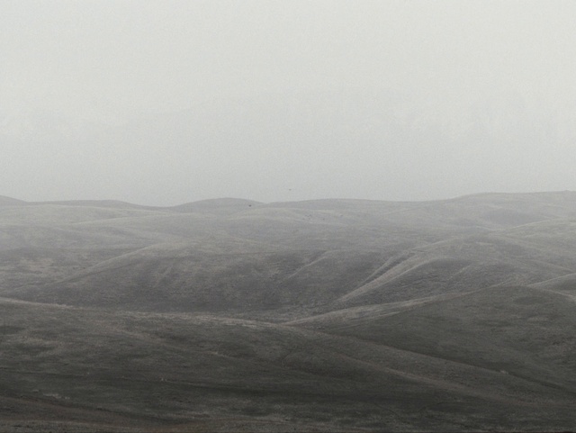 Video Reference: Sky, Mountain, Fog, Grey, Atmospheric phenomenon, Tree, Slope, Cloud, Landscape, Grassland
