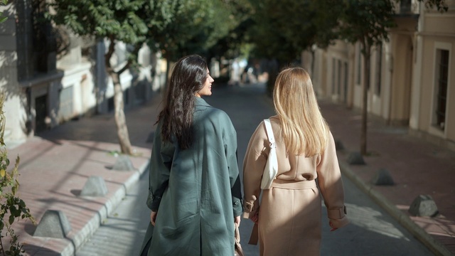 Video Reference: Hairstyle, Tree, Temple, Gesture, Waist, Travel, Leisure, Eyewear, Formal wear, Road