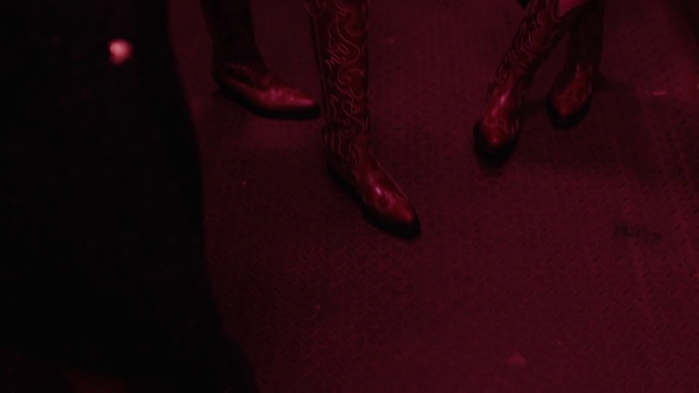 Video Reference: Flooring, Magenta, Human leg, Electric blue, Event, Carmine, Entertainment, Fashion accessory, Foot, Darkness
