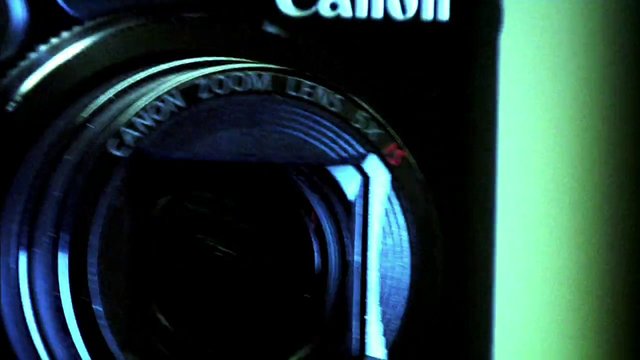 Video Reference: camera, lens, Canon, close-up, optics, photography, equipment, barrel, brand, dark, blue light, macro