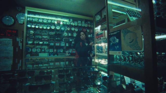 Video Reference: Aqua, Technology, Electric blue, Glass, Shelf, Darkness, Display device, City, Room, Electricity