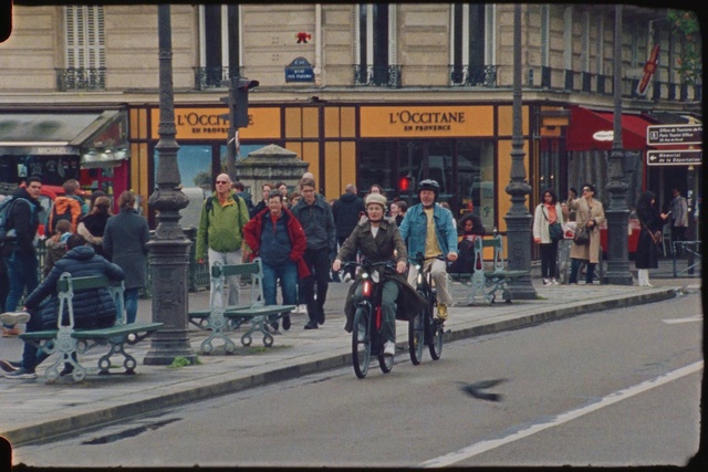 Video Reference: Window, Building, Infrastructure, Motor vehicle, Mode of transport, Asphalt, Sidewalk, Road surface, Metropolitan area, City