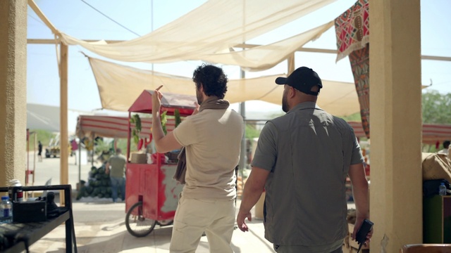 Video Reference: Shorts, Hat, Sky, Tire, Wheel, Shade, Baseball cap, Tent, Cap, People