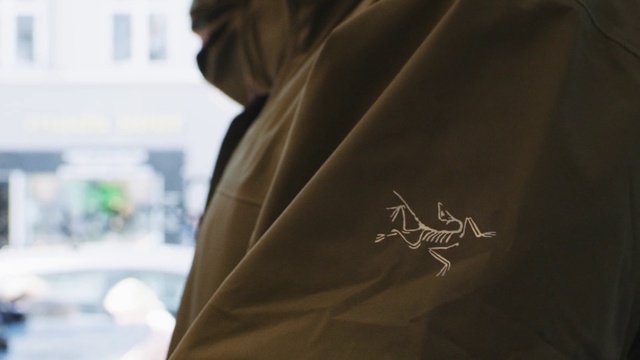 Video Reference: Sleeve, Automotive design, Blazer, Font, Street fashion, Tints and shades, Formal wear, T-shirt, Personal luxury car, Trench coat