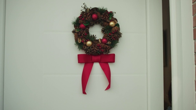 Video Reference: Wreath, Christmas ornament, Cross, Holiday ornament, Ornament, Twig, Font, Symbol, Religious item, Christmas decoration