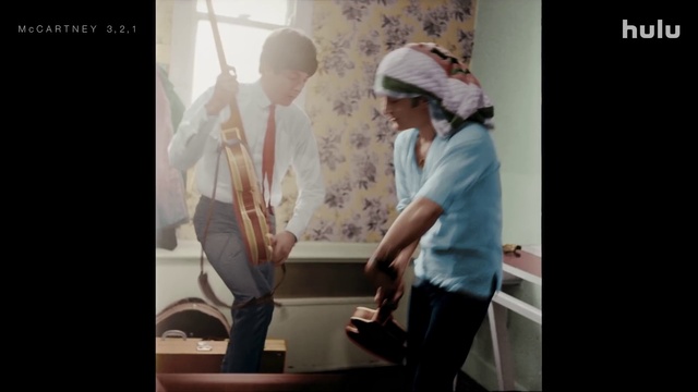 Video Reference: Sleeve, Gesture, Flash photography, Cap, Font, Baseball cap, Elbow, Electronic device, Display device, Event