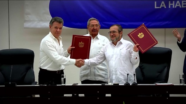 Video Reference: Greeting, Gesture, Tie, Flag, Handshake, Suit, Microphone, Event, Chair, Official