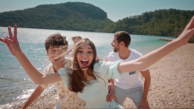 Video Reference: Face, Water, Smile, Sky, Shirt, People on beach, People in nature, Happy, Flash photography, Mountain