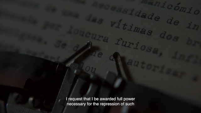 Video Reference: typewriter, printed text, Spanish, subtitles, close-up, dim light, document, literature, typing, paper, macro, dark, translation, archival, text