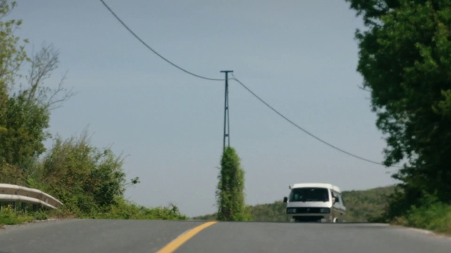 Video Reference: Sky, Plant, Vehicle, Motor vehicle, Tree, Car, Asphalt, Automotive lighting, Road surface, Overhead power line
