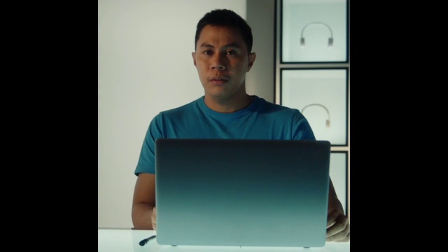 Video Reference: Azure, Sleeve, Gesture, T-shirt, Rectangle, Electric blue, Technology, Gadget, Event, Display device