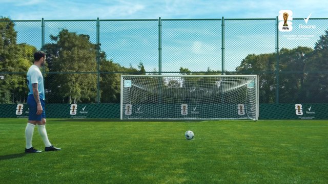 Video Reference: soccer, football, player, goal, ball, field, sports, training, outdoor, grass, net, pitch, practice, stadium, athlete