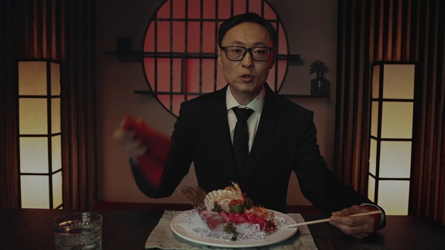 Video Reference: Glasses, Tableware, Food, Coat, Tie, Table, Plate, Dishware, Cake, Suit