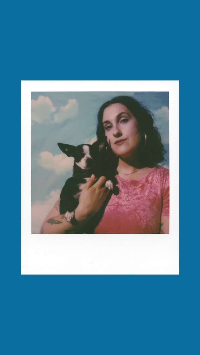 Video Reference: Hair, Dog, Arm, Shoulder, Dog breed, Carnivore, Neck, Sleeve, Cloud, Flash photography