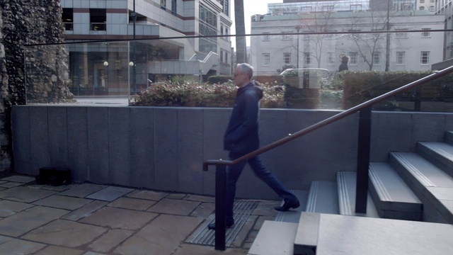 Video Reference: Building, Window, Grey, Plant, Urban design, Composite material, Road surface, Flooring, City, Urban area