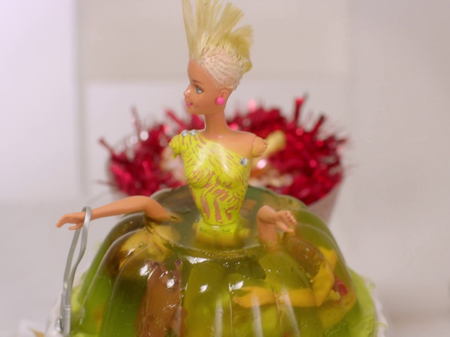 Video Reference: Toy, Event, Magenta, Art, Icing, Fashion accessory, Figurine, Perfume, Sweetness, Ornament