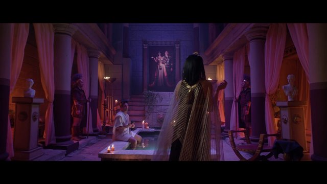 Video Reference: interior, classical, candlelight, columns, curtains, ceremony, people, pool, statues, painting, dramatic lighting, ancient style, luxury, theater set