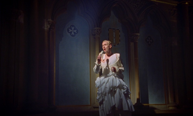 Video Reference: Flash photography, Door, Window, Entertainment, Performing arts, Beard, Event, Art, Formal wear, Sculpture