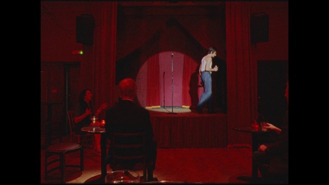 Video Reference: Theater curtain, Chair, Performing arts, Entertainment, Curtain, Suit, Music venue, Performance art, Event, Table