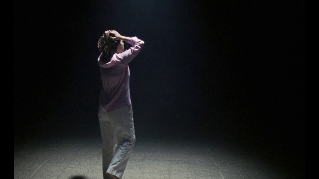 Video Reference: Trousers, Microphone, Human body, Flash photography, Grey, Musician, Entertainment, Artist, Music, Choreography