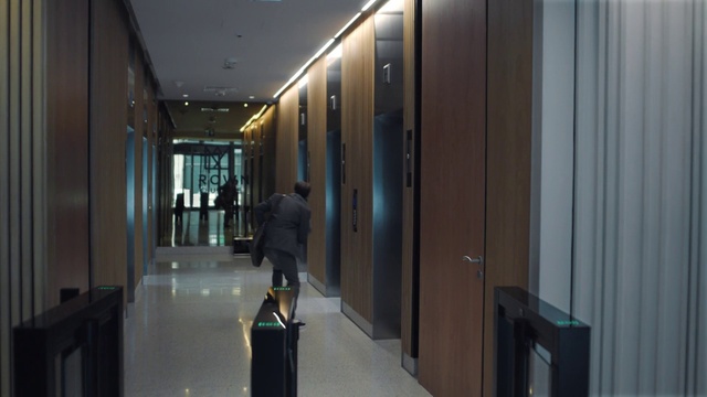 Video Reference: Fixture, Flooring, Floor, Glass, Building, Luggage and bags, Ceiling, Event, Bag, Door