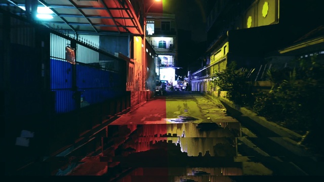 Video Reference: Automotive lighting, Building, Electricity, Street light, Road surface, Mode of transport, Window, Neighbourhood, City, Alley