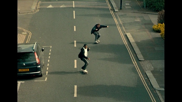 Video Reference: Vehicle, Asphalt, Road surface, Car, Yellow, Rolling, Motor vehicle, Skateboarder, Thoroughfare, Tints and shades
