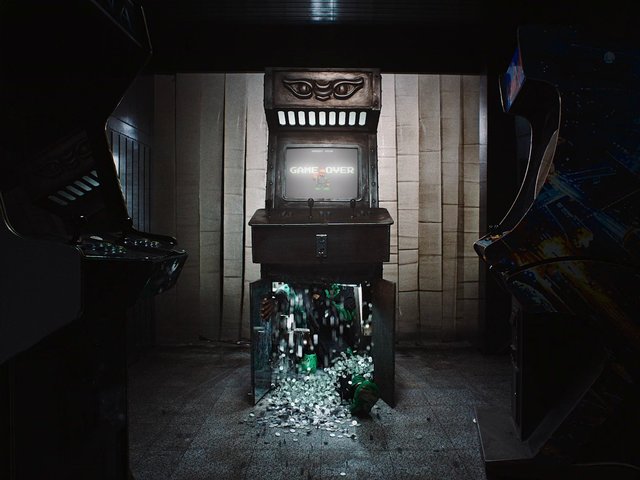 Video Reference: arcade, arcade machine, video game, game over, coins, coin spill, retro gaming, dark room, cabinet, vintage, indoor, eerie, gaming, machine, floor, retro