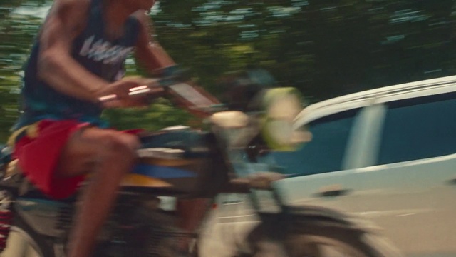 Video Reference: Shorts, Musician, Musical instrument, Motor vehicle, Thigh, Eyewear, Vehicle door, Automotive exterior, Chest, Competition event