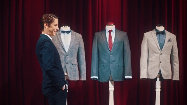 Video Reference: Suit trousers, Dress shirt, Human, Fashion, Curtain, Tie, Sleeve, Standing, Collar, Theater curtain