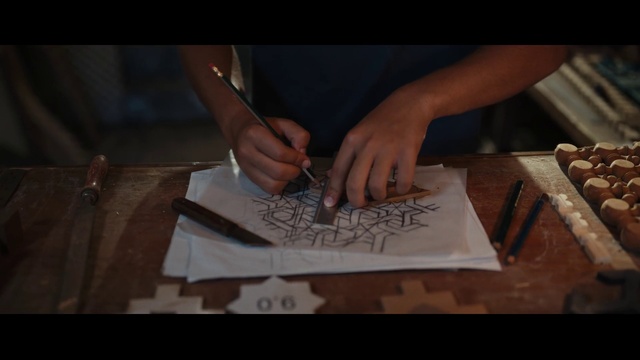 Video Reference: Hand, Automotive design, Artist, Gesture, Writing implement, Wood, Art, Finger, Office supplies, Font