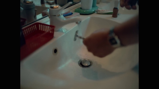 Video Reference: Hand, Tap, Plumbing fixture, Bathroom, Sink, Fluid, Bathroom sink, Wood, Plumbing, Floor