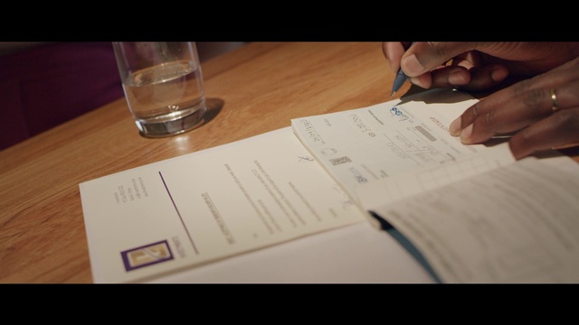 Video Reference: Hand, Finger, Table, Font, Handwriting, Office supplies, Cloud, Material property, Tableware, Gesture