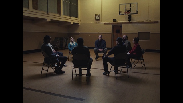 Video Reference: Basketball hoop, Basketball, Chair, Table, Event, Flooring, Room, Hall, Television, Sitting