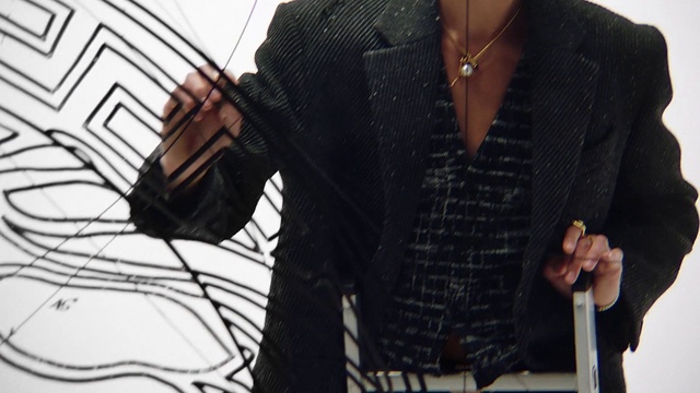 Video Reference: Dress shirt, Neck, Sleeve, Tartan, Collar, Waist, Plaid, Blazer, Eyewear, Formal wear